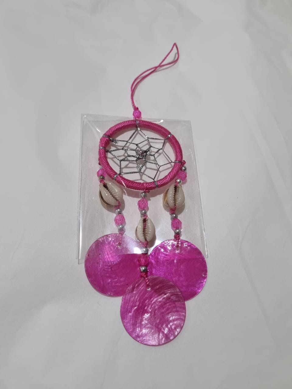 Colorful mini dreamcatcher keychain with natural shells and nylon webbing — perfect for car or wall hanging