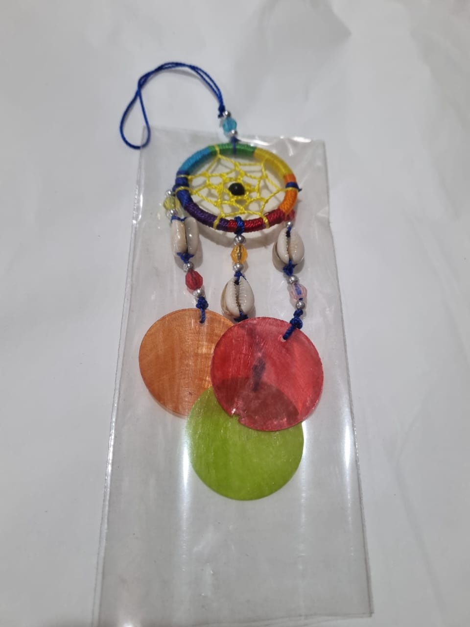 Colorful mini dreamcatcher keychain with natural shells and nylon webbing — perfect for car or wall hanging