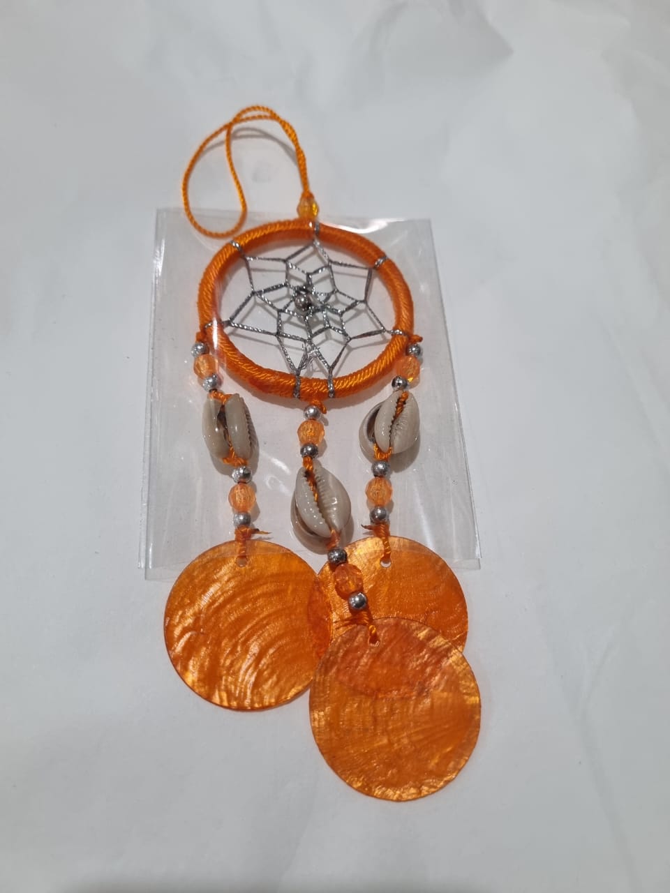 Colorful mini dreamcatcher keychain with natural shells and nylon webbing — perfect for car or wall hanging