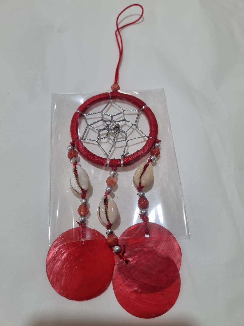 Colorful mini dreamcatcher keychain with natural shells and nylon webbing — perfect for car or wall hanging