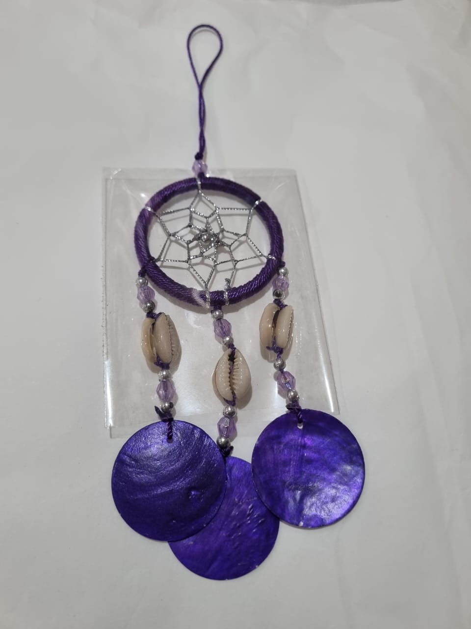 Colorful mini dreamcatcher keychain with natural shells and nylon webbing — perfect for car or wall hanging