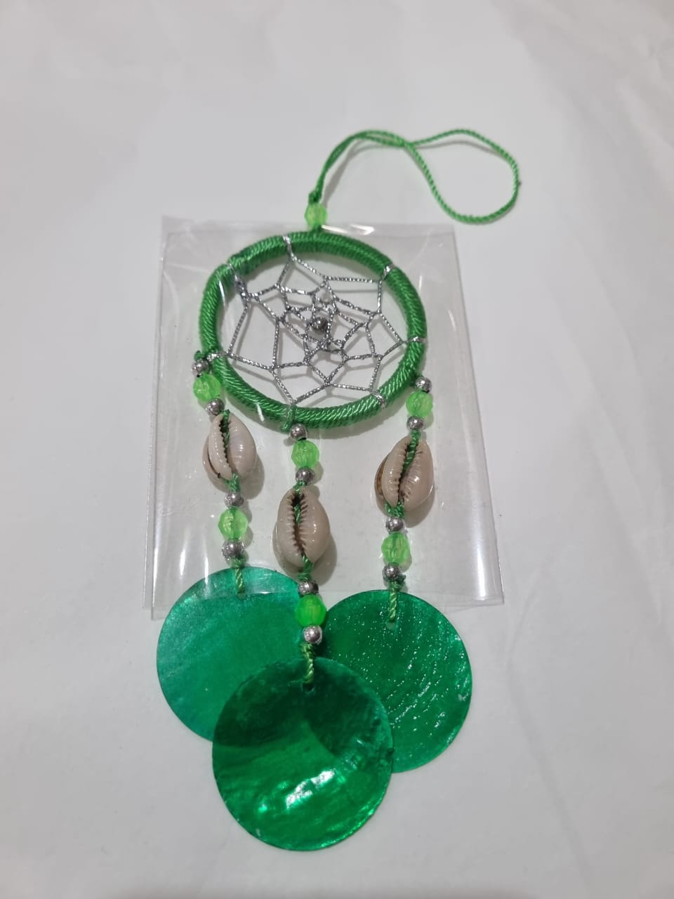 Colorful mini dreamcatcher keychain with natural shells and nylon webbing — perfect for car or wall hanging