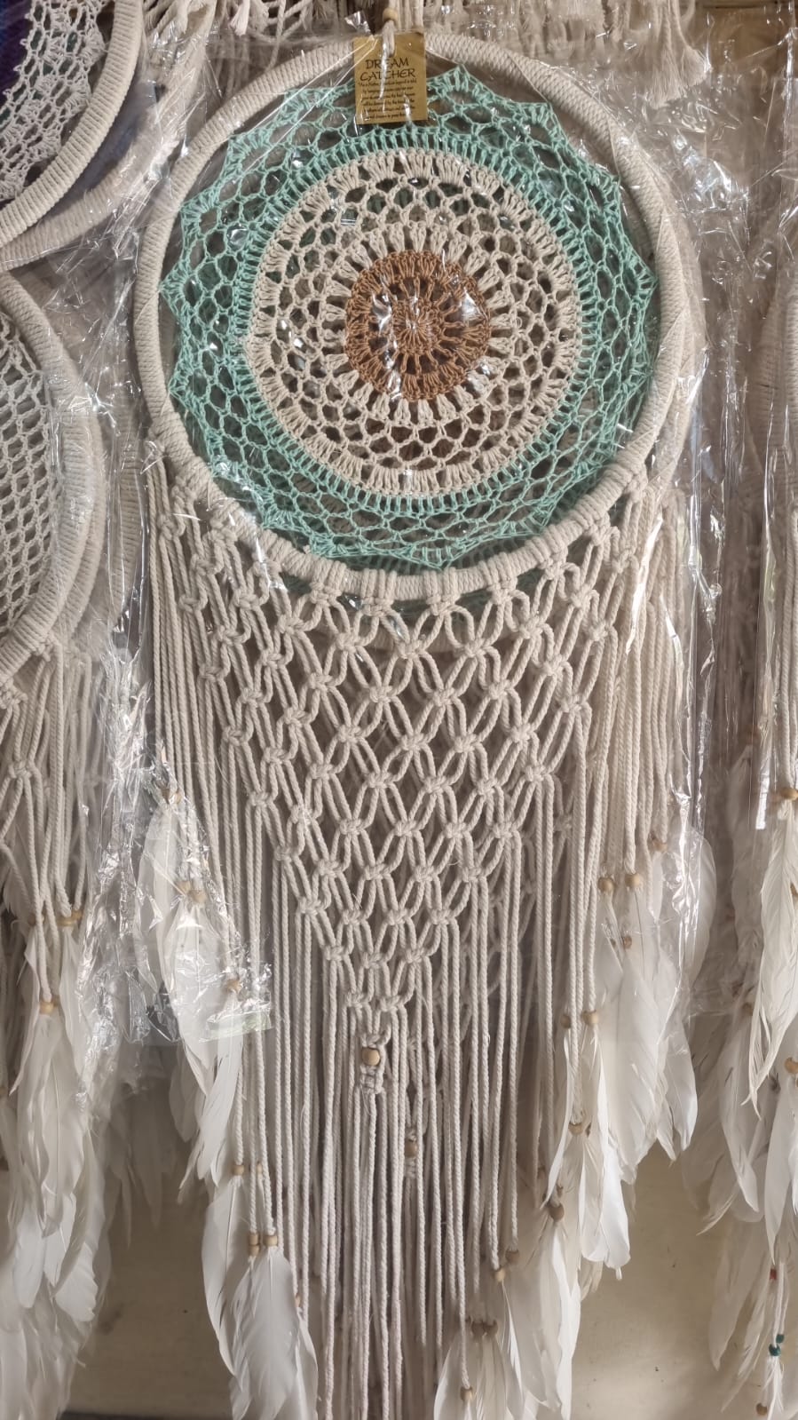 32cm handmade macrame dreamcatcher with cotton crochet center and long feather fringe – bohemian wall decor for modern spaces