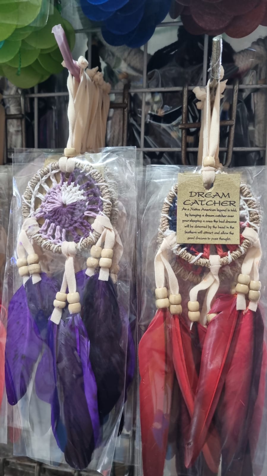 Small handmade agel dreamcatcher 6cm with natural wood beads and colorful feathers.