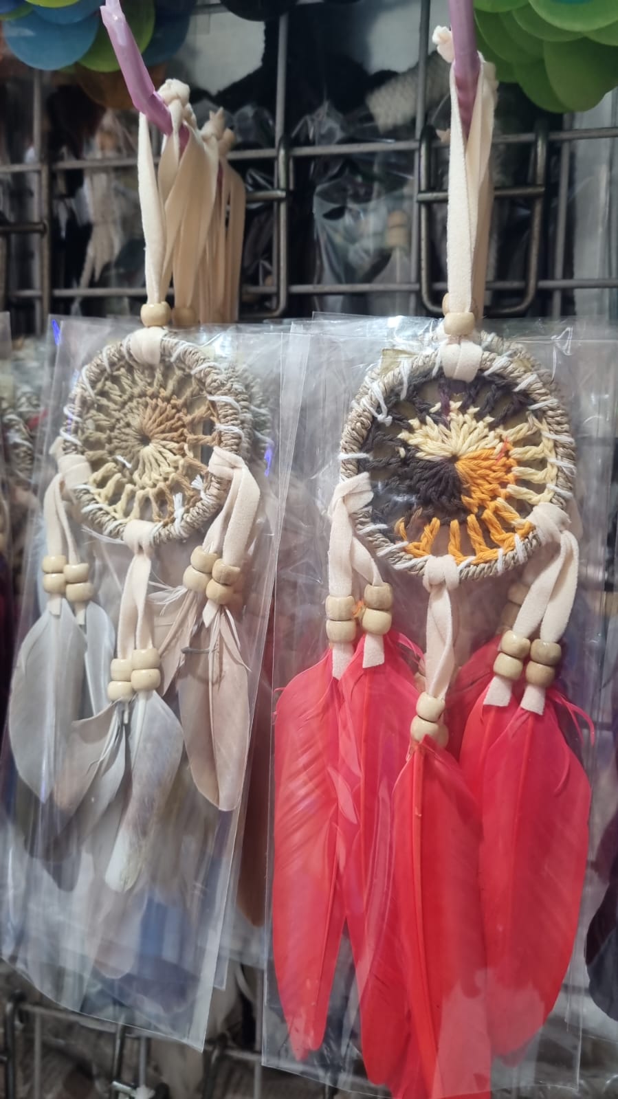 Small handmade agel dreamcatcher 6cm with natural wood beads and colorful feathers.