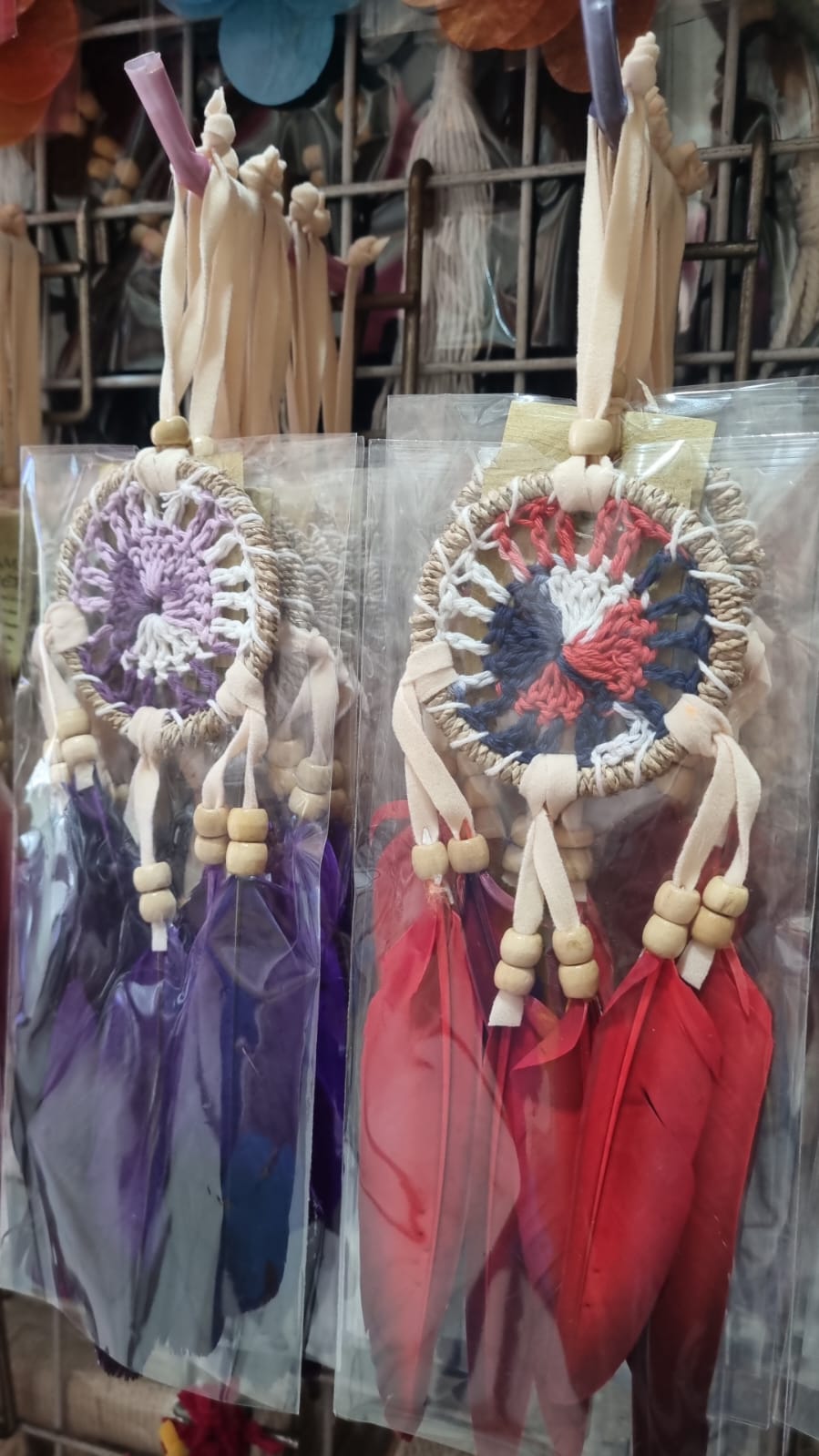 Small handmade agel dreamcatcher 6cm with natural wood beads and colorful feathers.