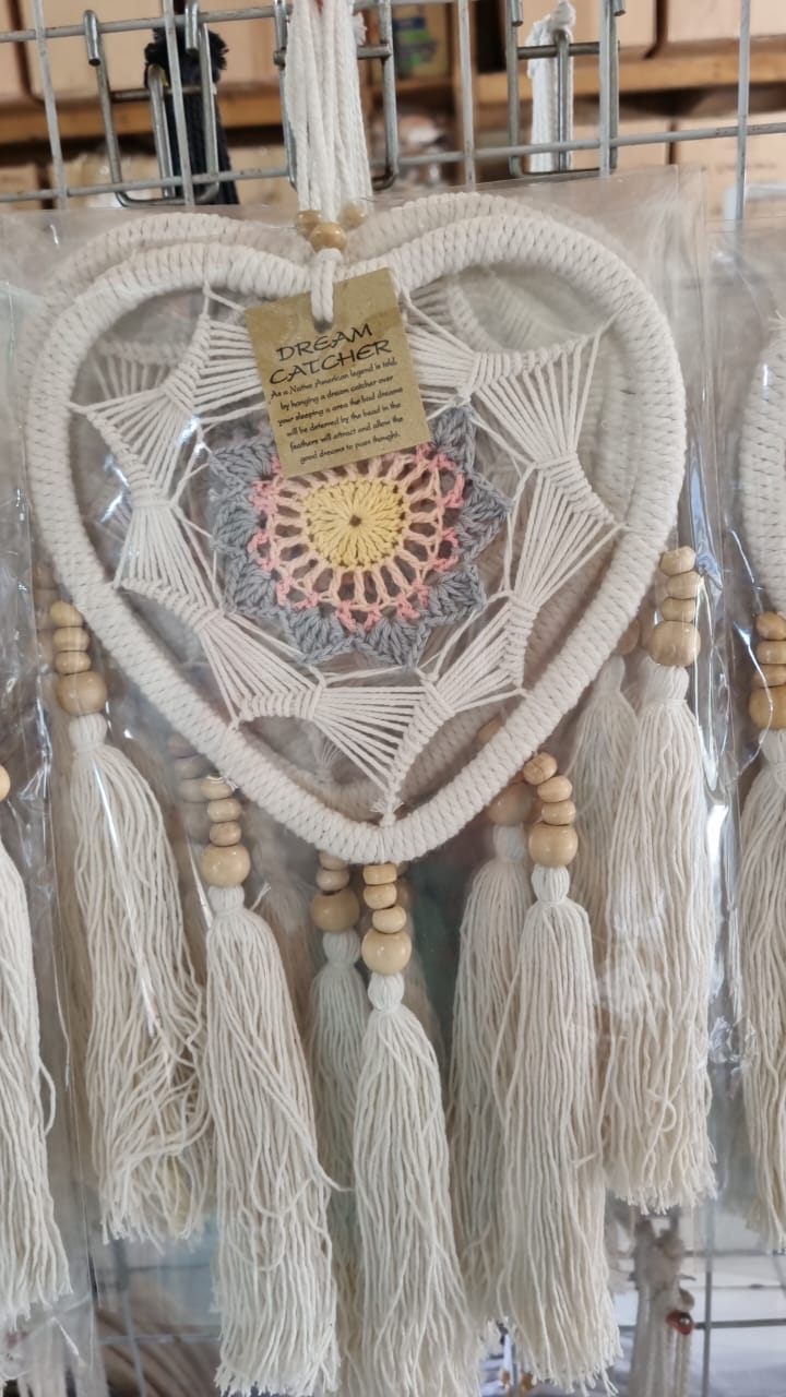 Macrame heart-shaped dreamcatcher with soft cotton tassels, wooden beads, and colorful crochet center