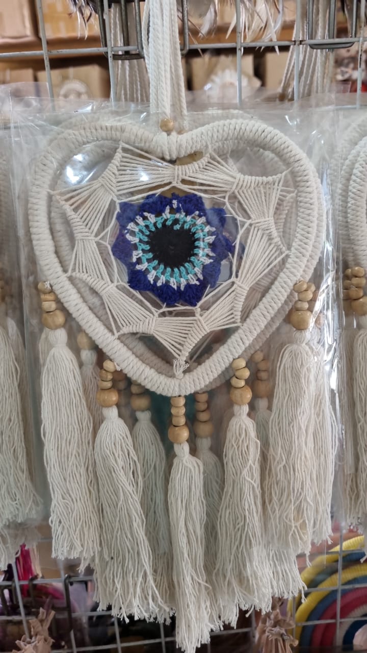 Macrame heart-shaped dreamcatcher with soft cotton tassels, wooden beads, and colorful crochet center
