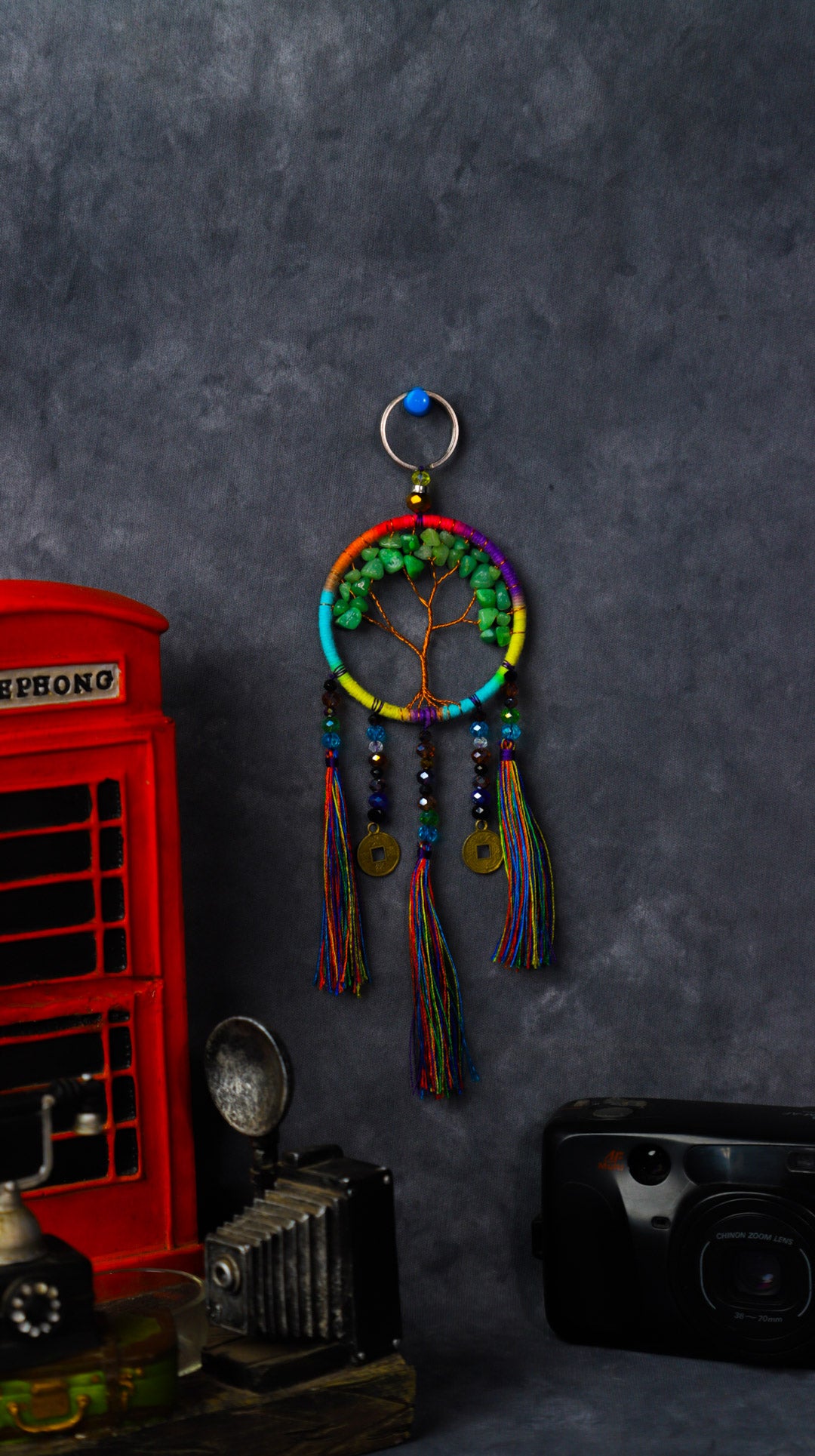 Turquoise-wrapped Tree of Life dreamcatcher keychain with green stone leaves and teal tassels.