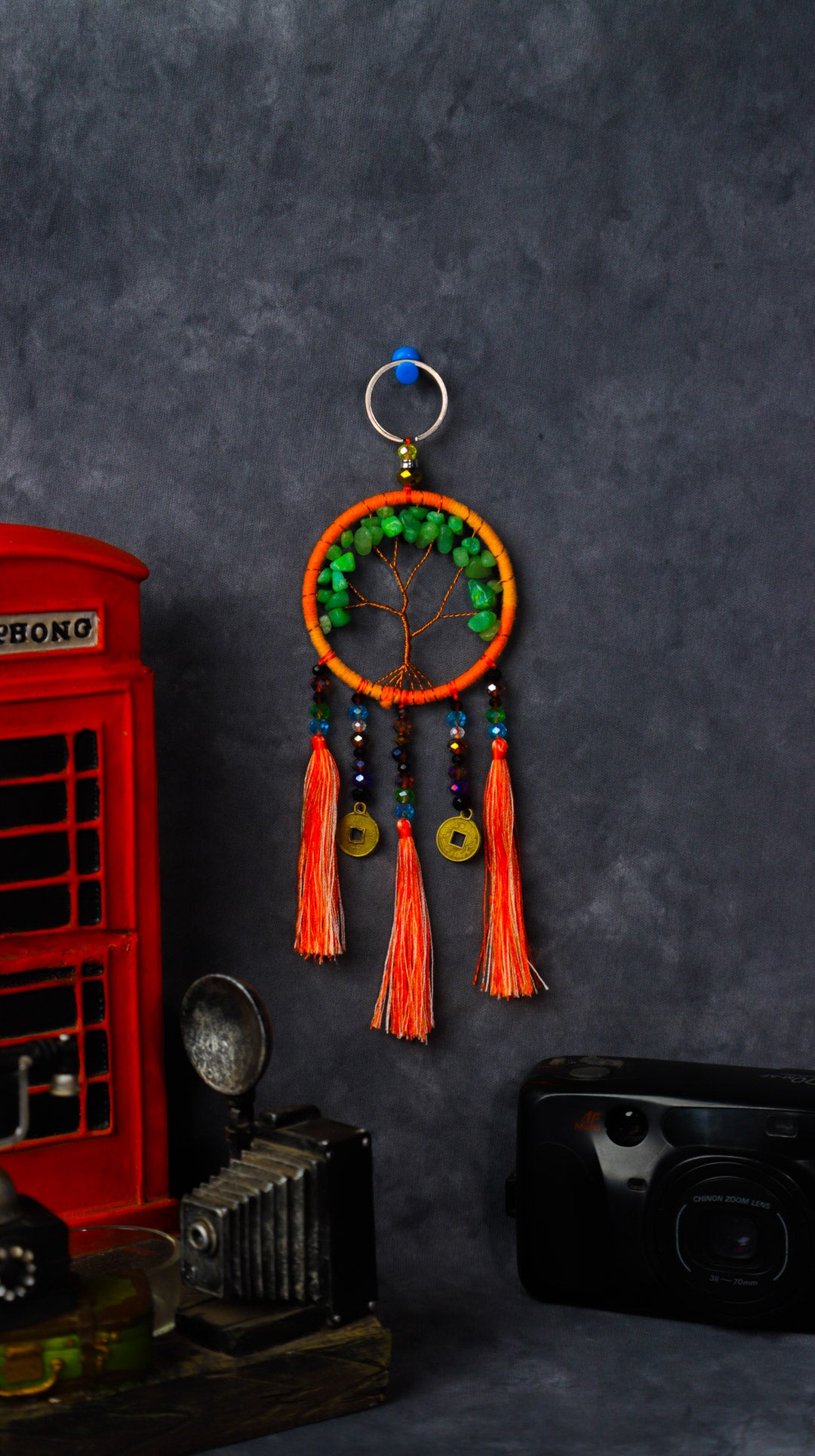 Turquoise-wrapped Tree of Life dreamcatcher keychain with green stone leaves and teal tassels.
