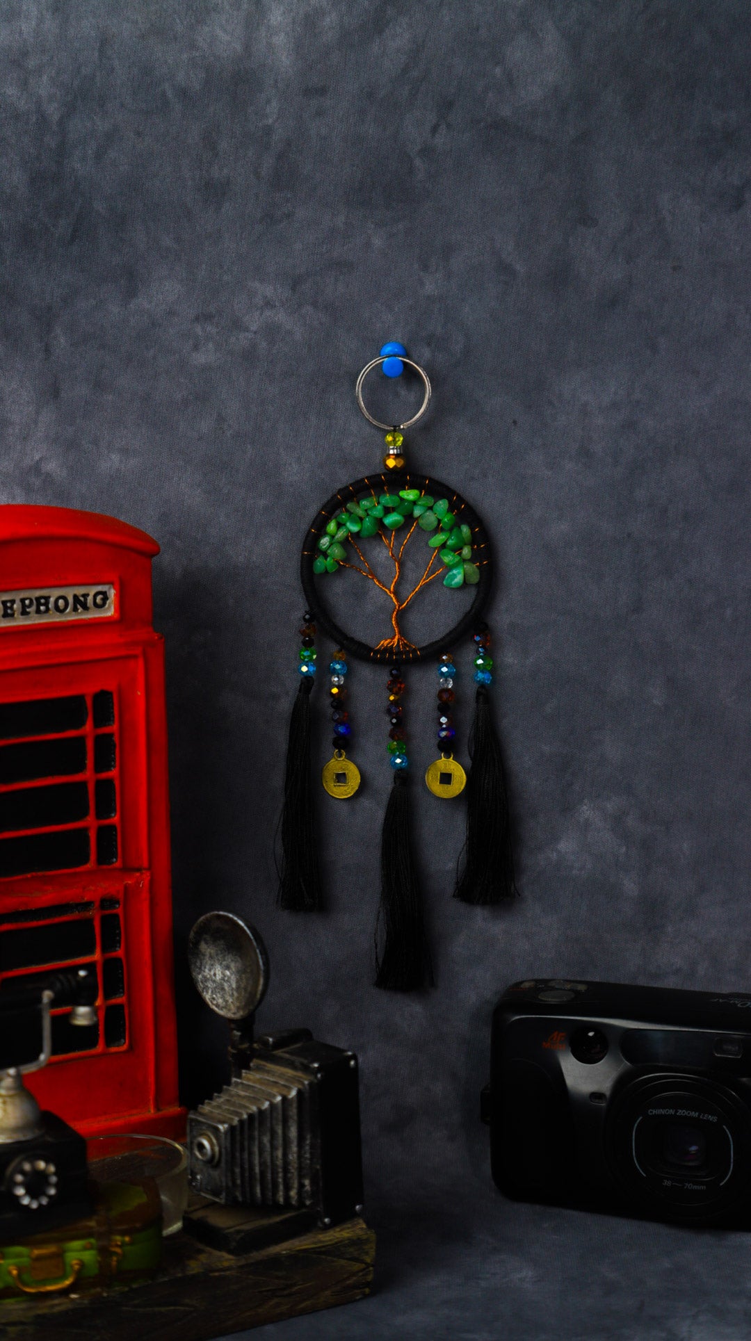 Turquoise-wrapped Tree of Life dreamcatcher keychain with green stone leaves and teal tassels.