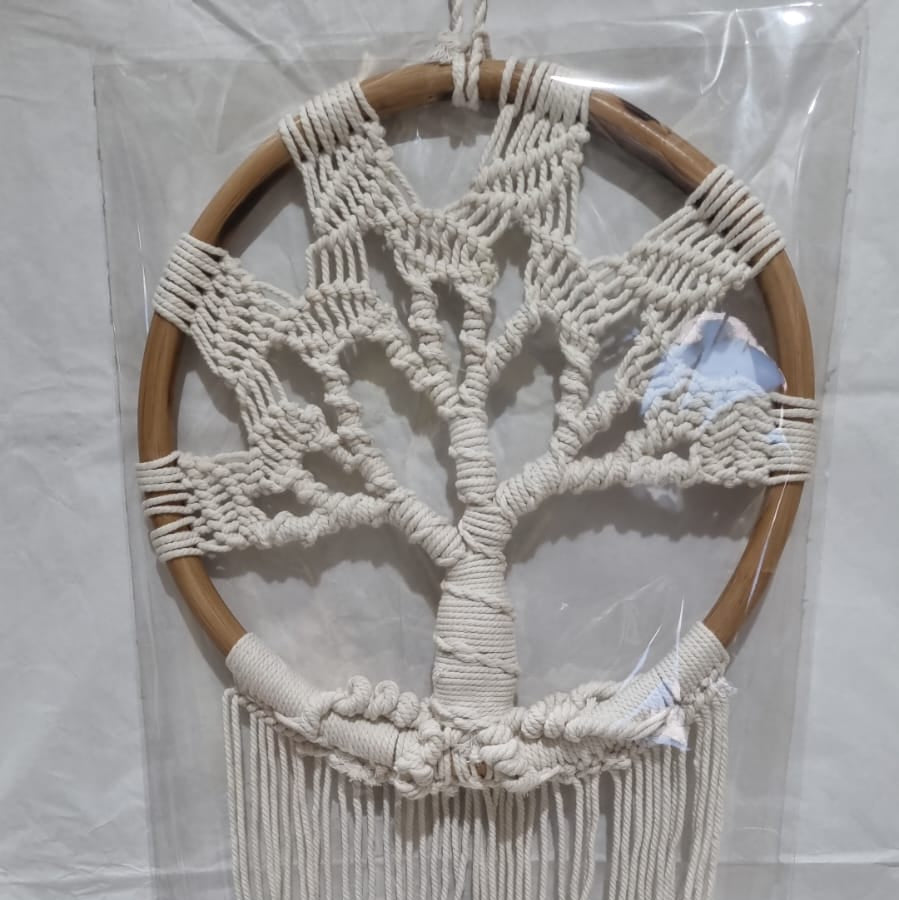 Handmade Tree of Life dreamcatcher made with macrame cotton rope and a rattan ring, featuring minimalist fringe for boho and spiritual interiors.