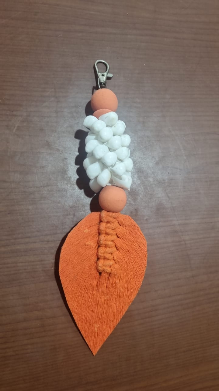 Handcrafted wooden shell keychain with colorful cotton tassel, perfect for wholesale and custom orders