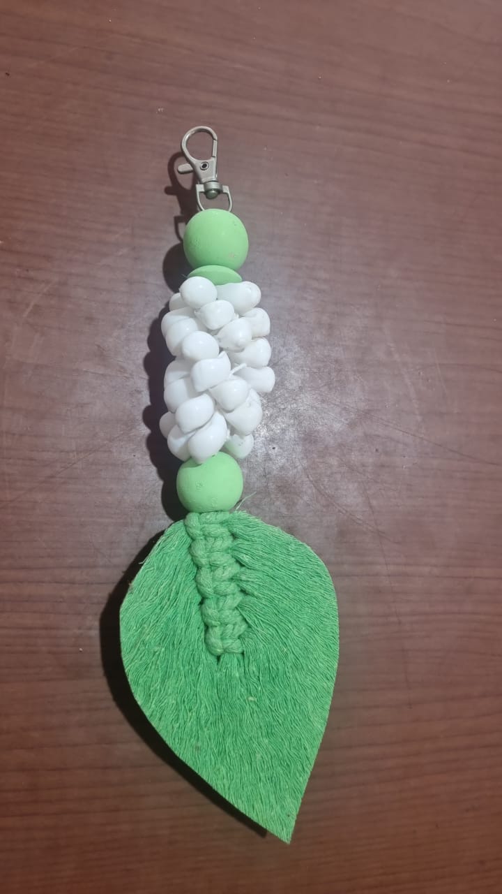 Handcrafted wooden shell keychain with colorful cotton tassel, perfect for wholesale and custom orders