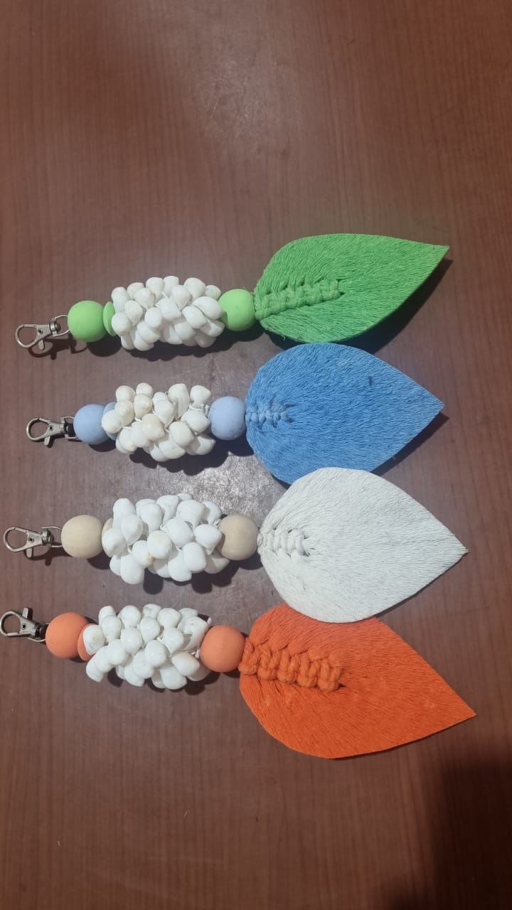 Handcrafted wooden shell keychain with colorful cotton tassel, perfect for wholesale and custom orders