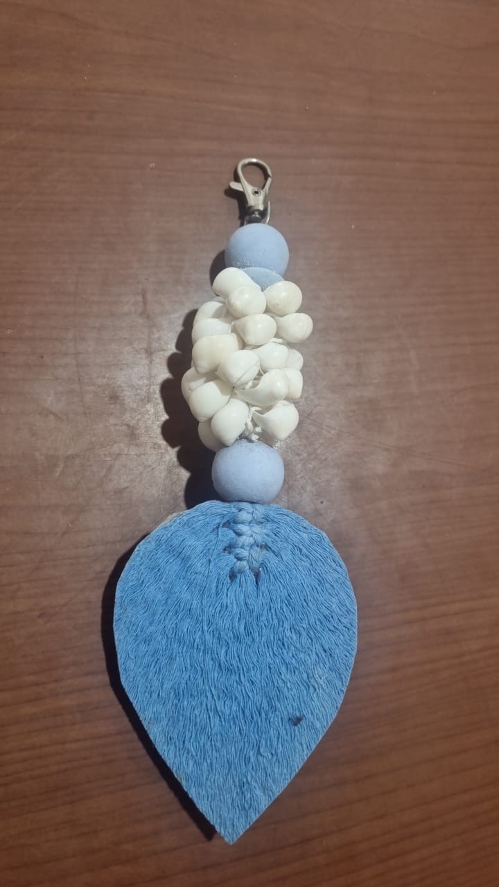 Handcrafted wooden shell keychain with colorful cotton tassel, perfect for wholesale and custom orders