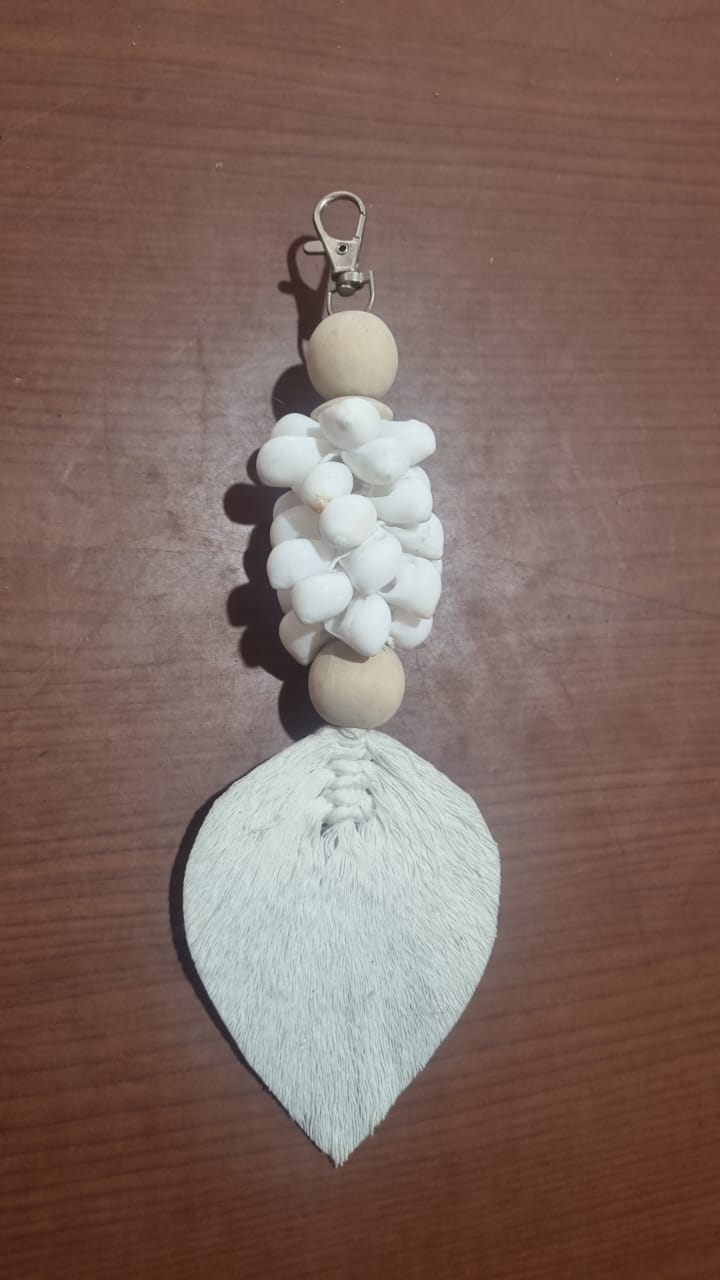 Handcrafted wooden shell keychain with colorful cotton tassel, perfect for wholesale and custom orders