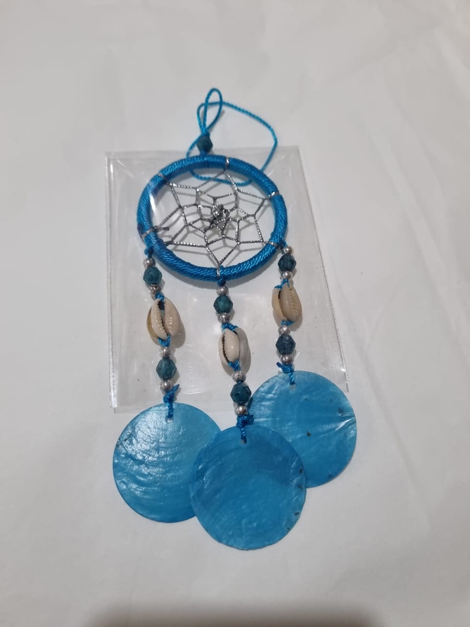Colorful mini dreamcatcher keychain with natural shells and nylon webbing — perfect for car or wall hanging