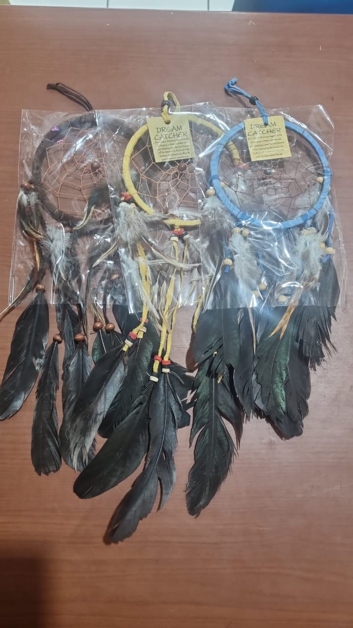 Artisan handmade dreamcatcher with cotton wrap, feathers, and wooden beads, 12cm diameter