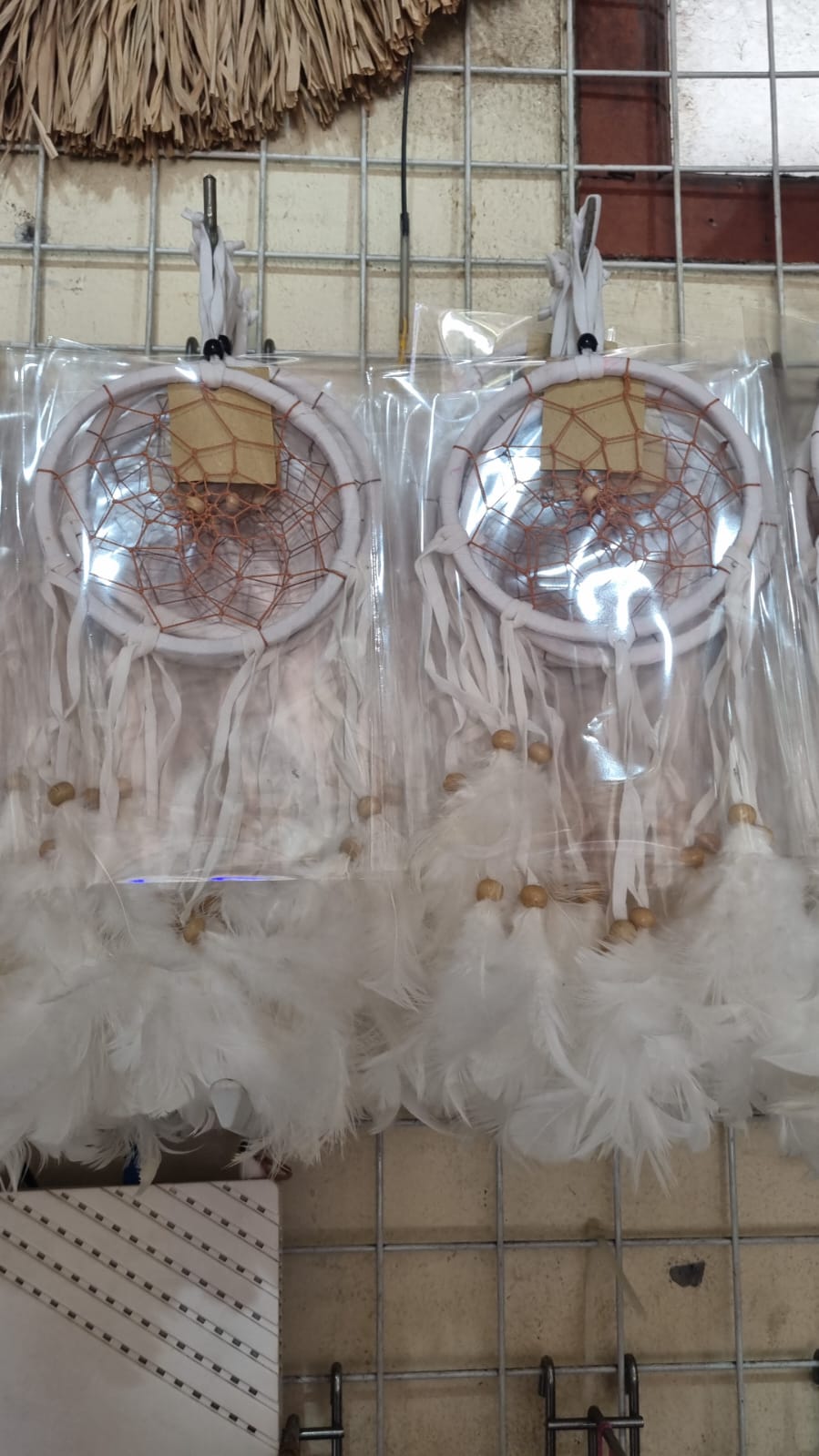 12cm handmade suede dreamcatcher with white feathers and wood beads – perfect for home décor or wholesale gifts.