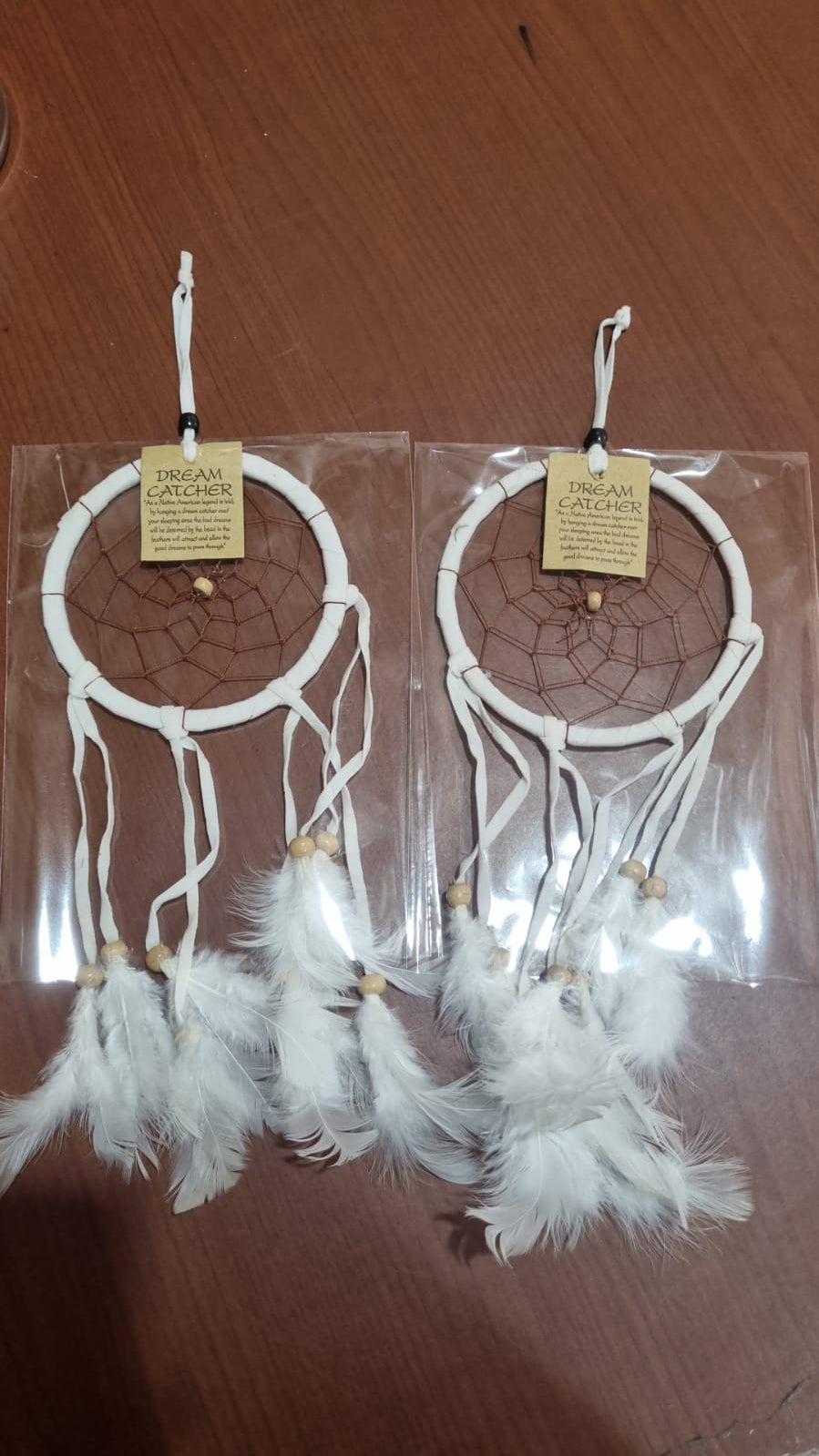 12cm handmade suede dreamcatcher with white feathers and wood beads – perfect for home décor or wholesale gifts.