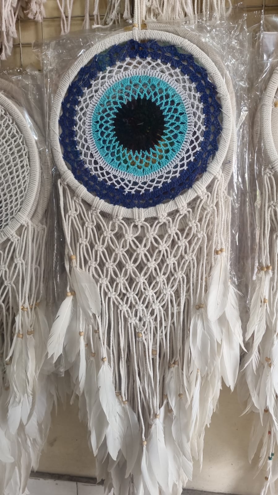 32cm handmade macrame dreamcatcher with cotton crochet center and long feather fringe – bohemian wall decor for modern spaces
