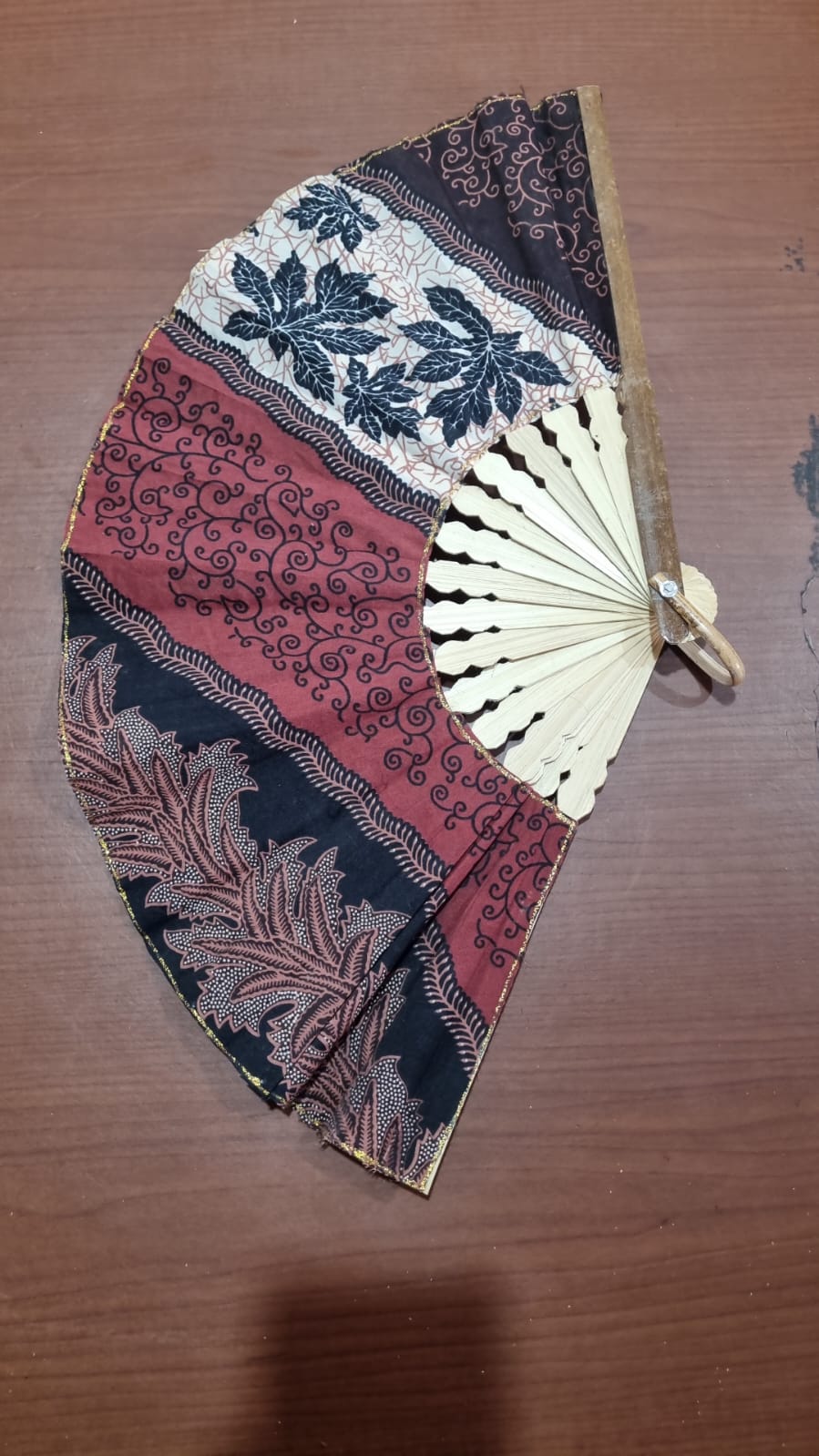 30 cm handmade batik cotton fan with natural bamboo handle, ideal for summer use, décor, and event souvenirs.
