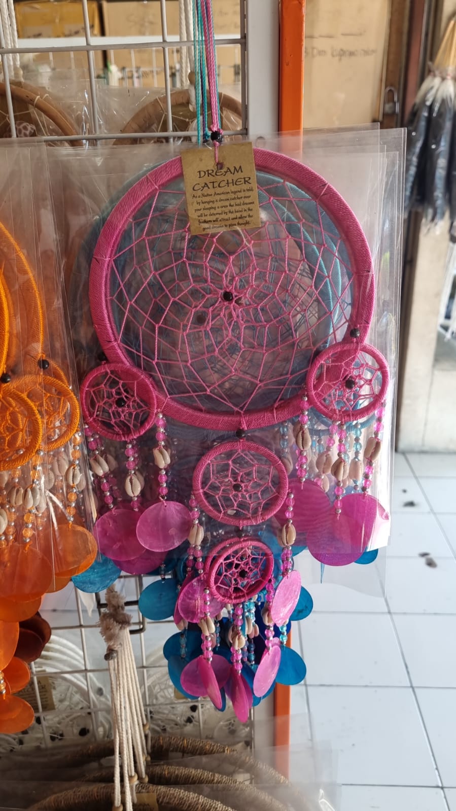 Colorful handmade dreamcatcher 16cm with nylon web, capiz shell discs, cowrie shells, boho wall hanging.