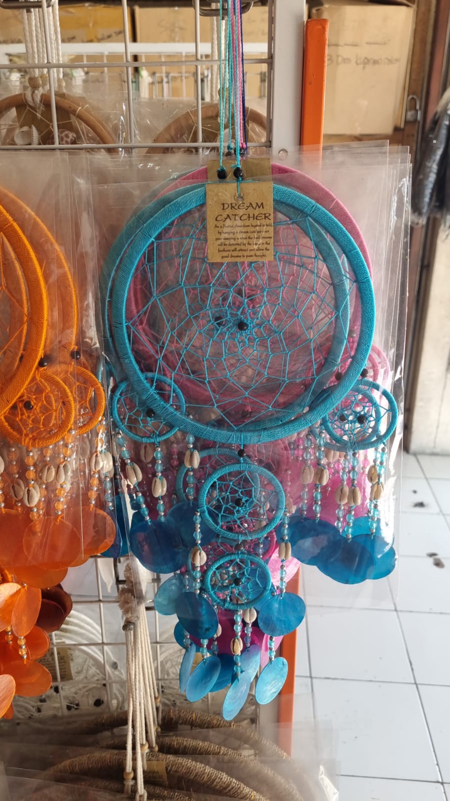 Colorful handmade dreamcatcher 16cm with nylon web, capiz shell discs, cowrie shells, boho wall hanging.