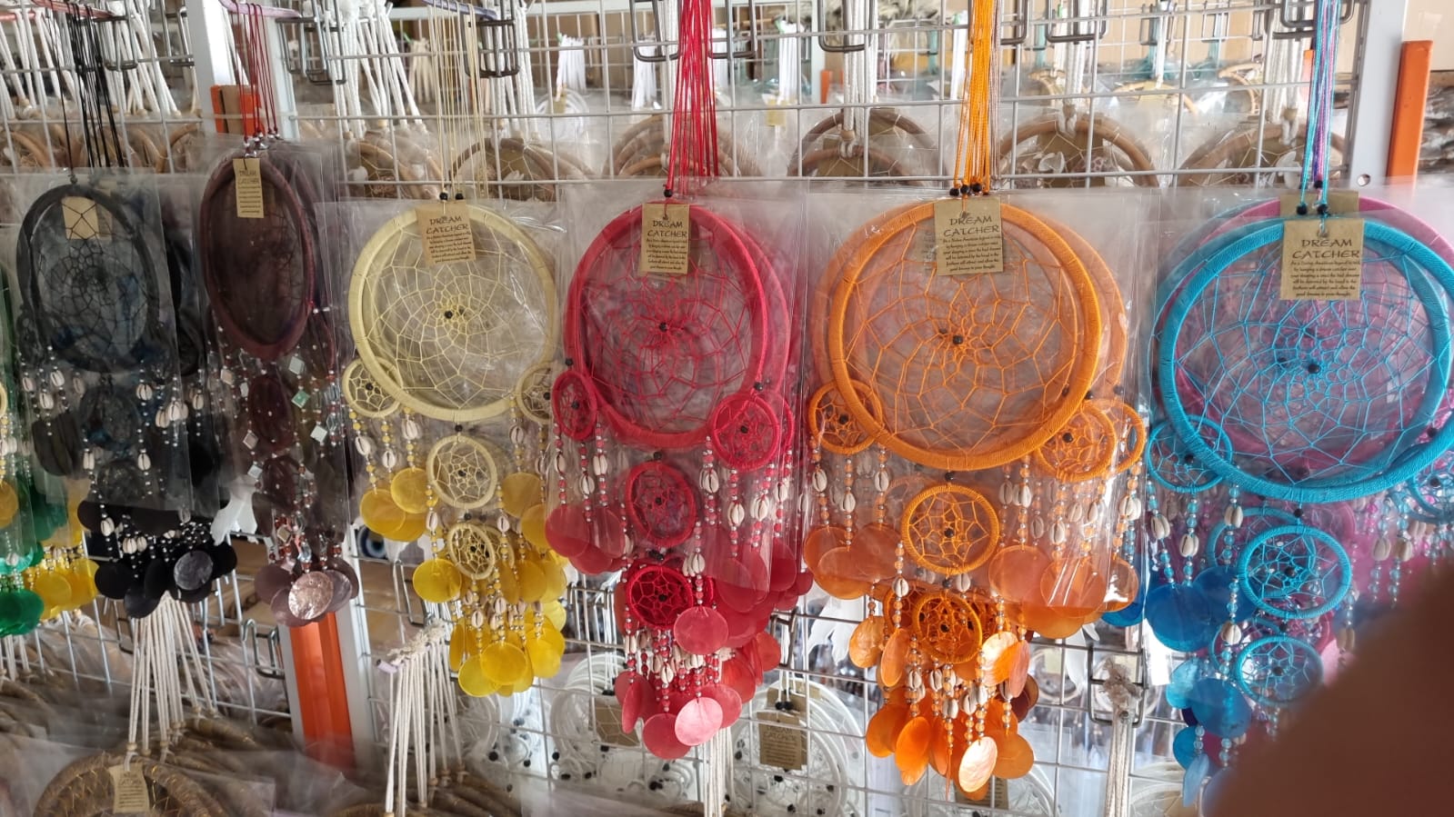 Colorful handmade dreamcatcher 16cm with nylon web, capiz shell discs, cowrie shells, boho wall hanging.