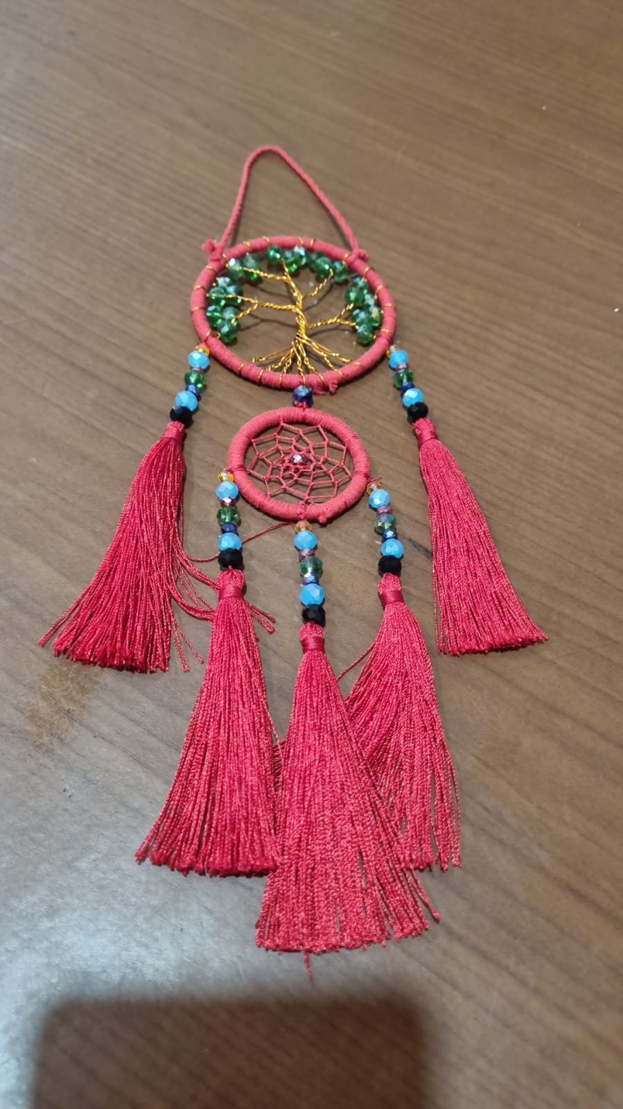 Handcrafted Tree of Life dreamcatcher 6cm with red tassels and crystal beads — boho home décor and gift item.
