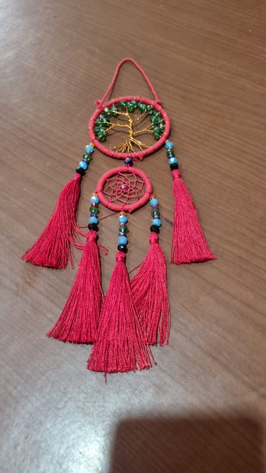 Handcrafted Tree of Life dreamcatcher 6cm with red tassels and crystal beads — boho home décor and gift item.