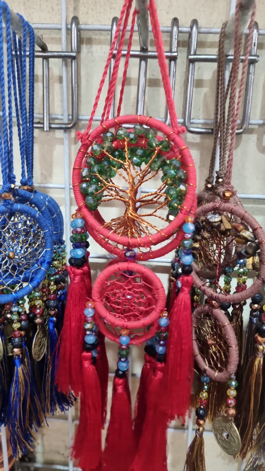 Handcrafted Tree of Life dreamcatcher 6cm with red tassels and crystal beads — boho home décor and gift item.