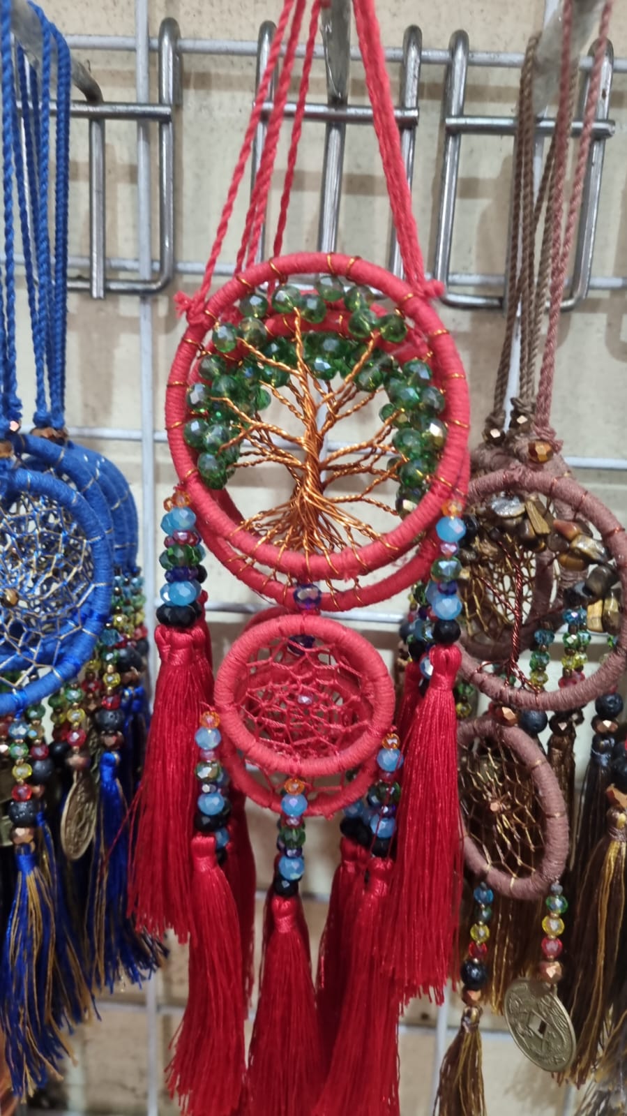 Handcrafted Tree of Life dreamcatcher 6cm with red tassels and crystal beads — boho home décor and gift item.