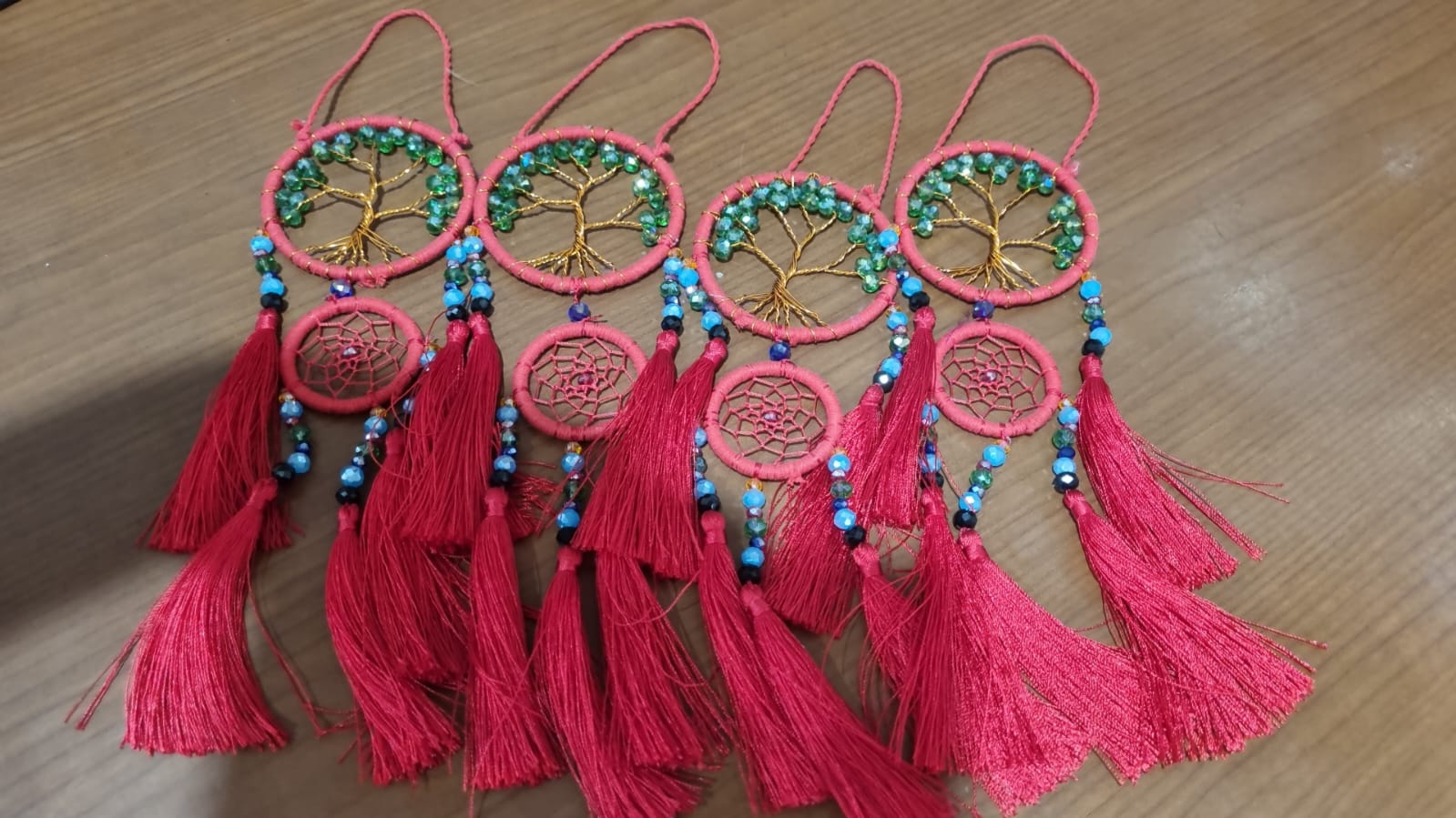 Handcrafted Tree of Life dreamcatcher 6cm with red tassels and crystal beads — boho home décor and gift item.