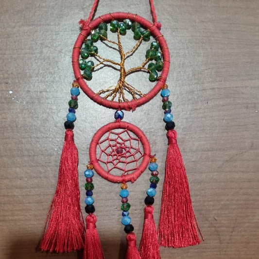 Artisan dreamcatcher with red tassels, tree of life wire design, and green crystal beads