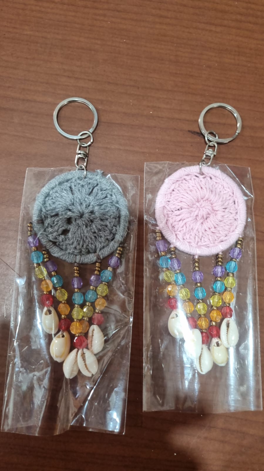 Mini dreamcatcher keychain handmade with cotton crochet, colorful beads, and shells