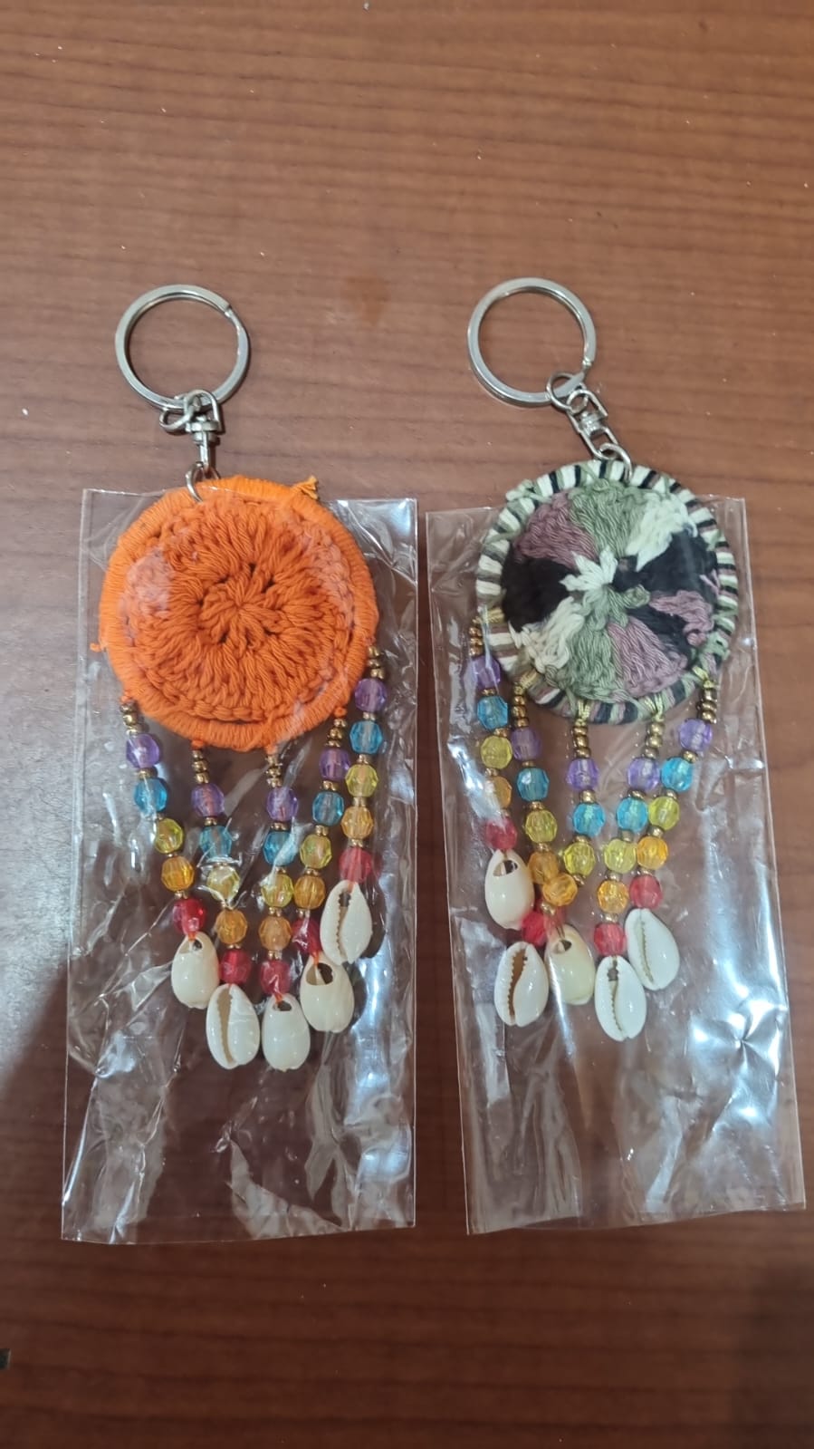 Mini dreamcatcher keychain handmade with cotton crochet, colorful beads, and shells