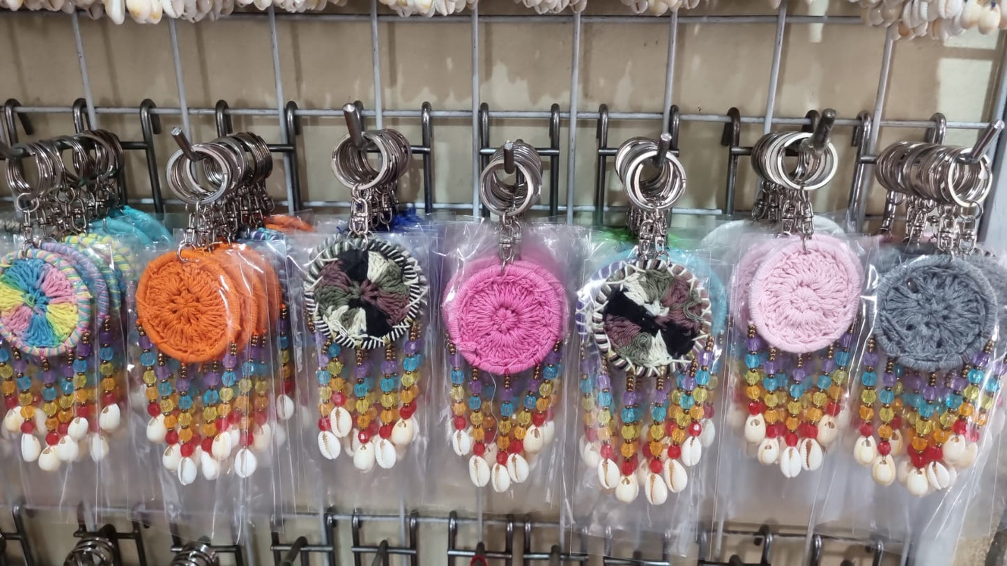 Mini dreamcatcher keychain handmade with cotton crochet, colorful beads, and shells