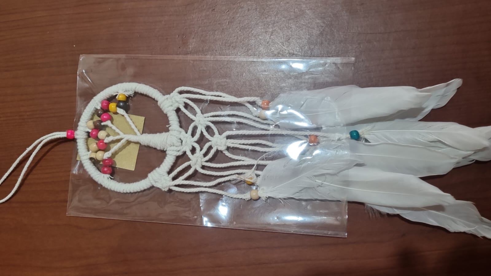 Mini handmade Tree of Life dreamcatcher with cotton cord, wooden beads, and white feathers – 7 cm (2.75 inch) wall hanging decor.