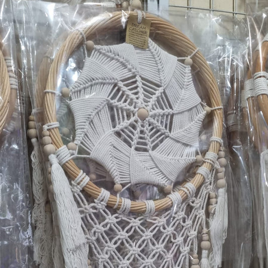 Rattan dreamcatcher with cotton spiral web and tassels, featuring wooden beads, perfect for boho wall décor or gifting.