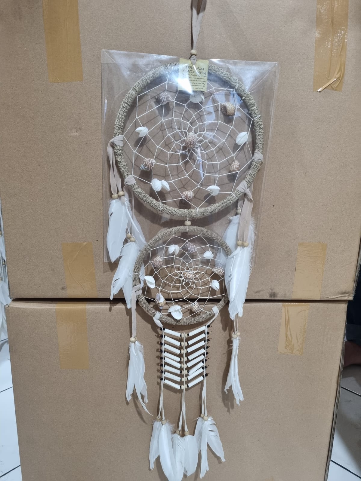 Double hoop dreamcatcher with agel fiber, white feathers, bone beads, and natural shells – perfect for boho decor