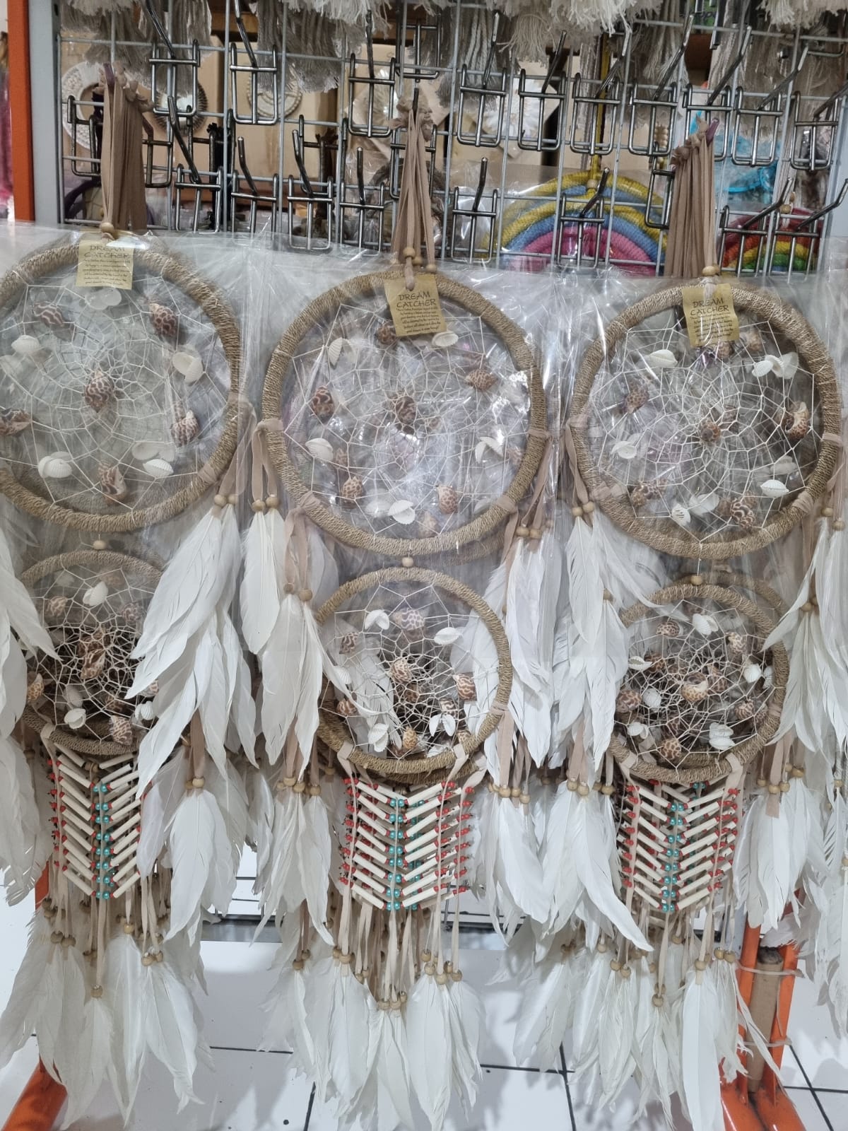 Double hoop dreamcatcher with agel fiber, white feathers, bone beads, and natural shells – perfect for boho decor