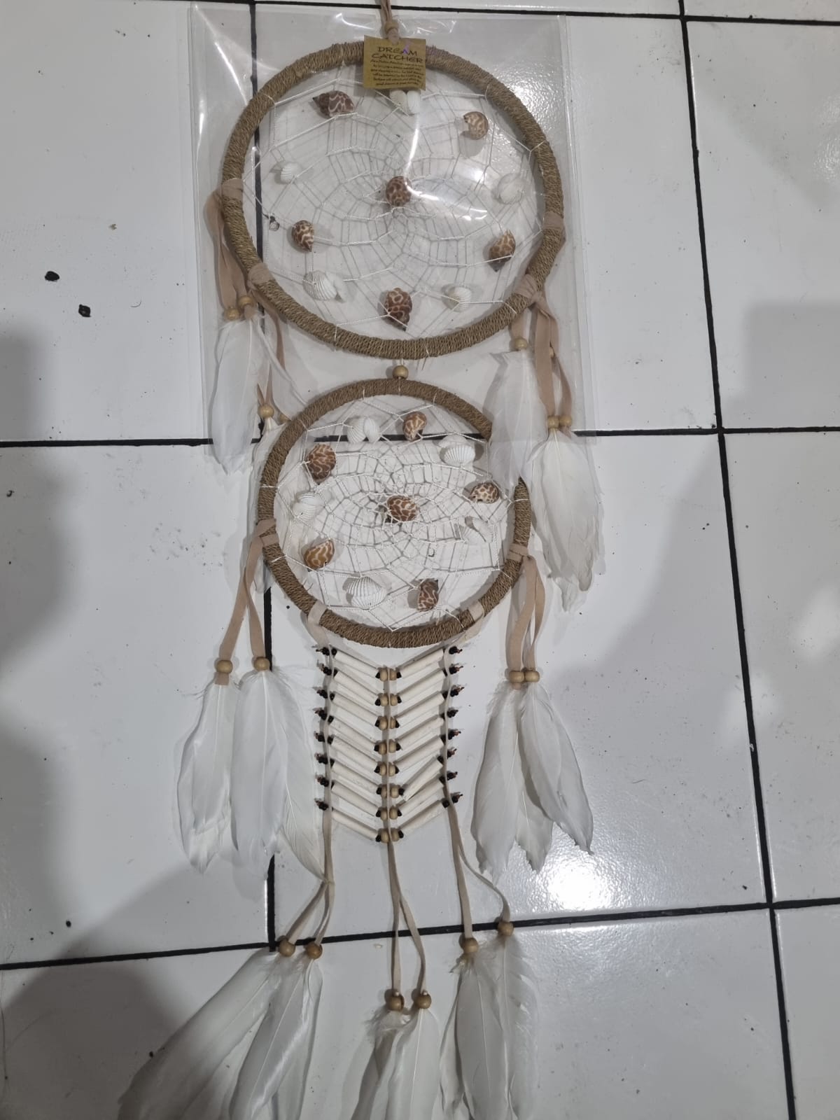 Double hoop dreamcatcher with agel fiber, white feathers, bone beads, and natural shells – perfect for boho decor