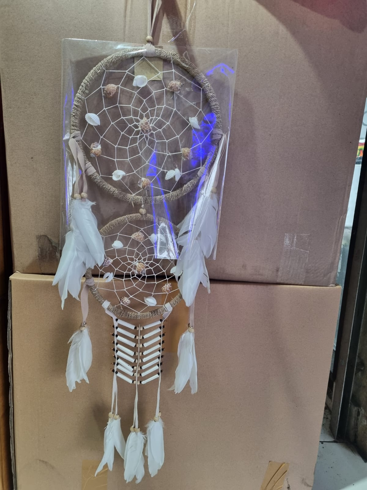 Double hoop dreamcatcher with agel fiber, white feathers, bone beads, and natural shells – perfect for boho decor