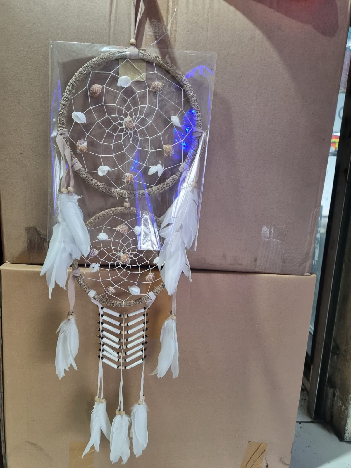 Double hoop dreamcatcher with agel fiber, white feathers, bone beads, and natural shells – perfect for boho decor