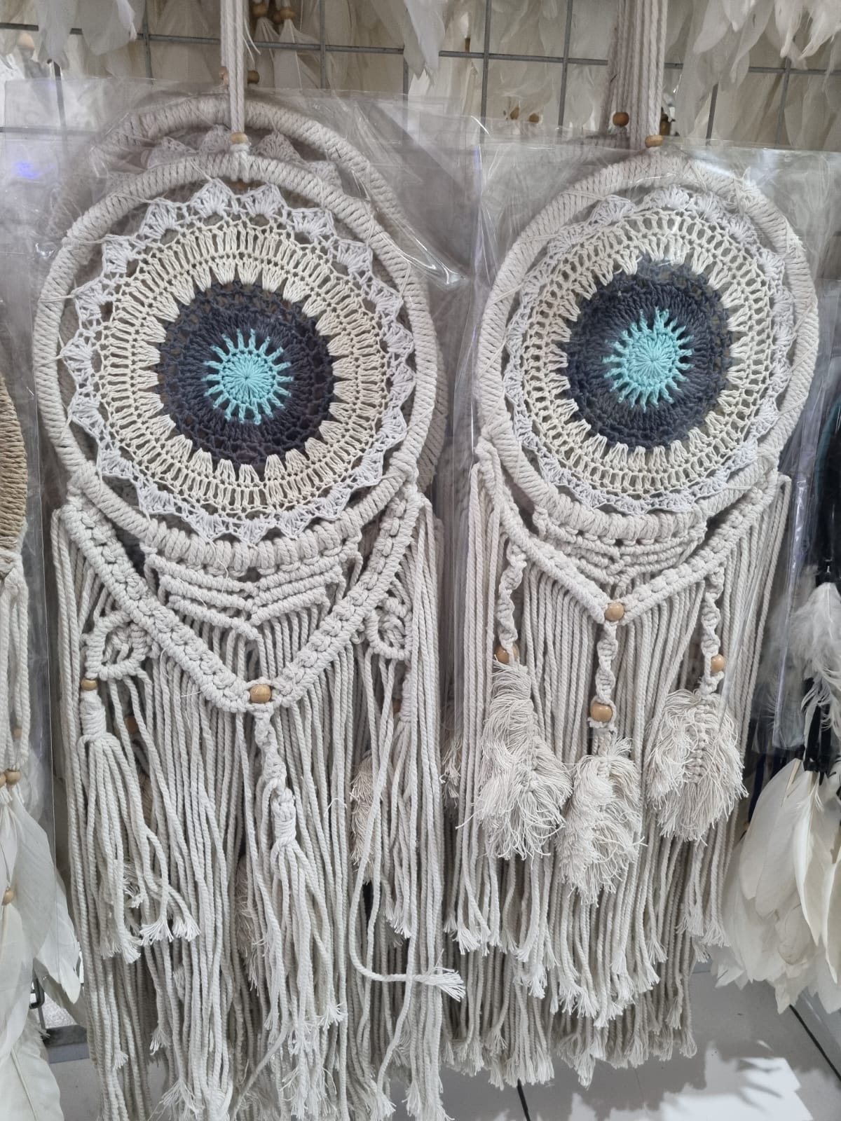 Crochet and macrame cotton dreamcatcher with evil eye motif and hanging tassels, 22cm diameter, handmade spiritual decor


