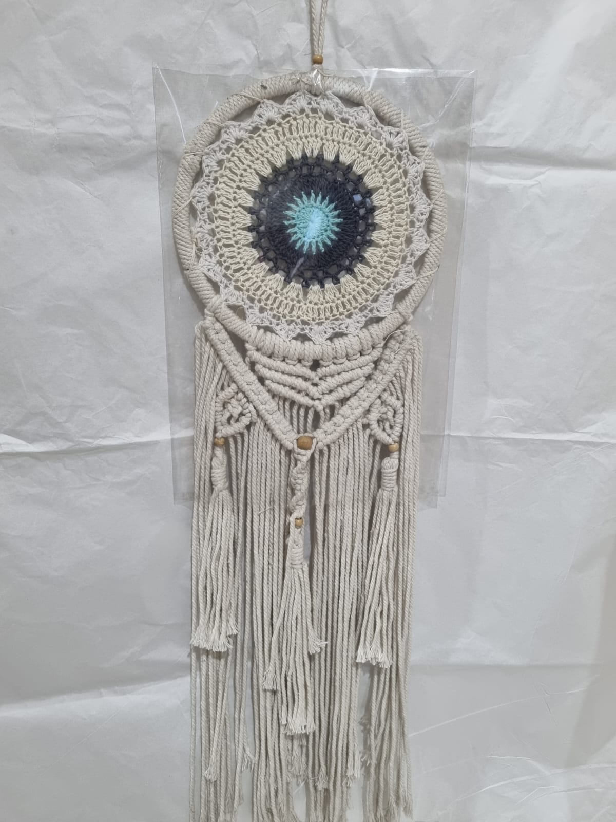 Crochet and macrame cotton dreamcatcher with evil eye motif and hanging tassels, 22cm diameter, handmade spiritual decor

