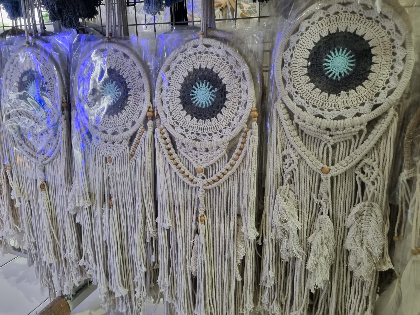 Crochet and macrame cotton dreamcatcher with evil eye motif and hanging tassels, 22cm diameter, handmade spiritual decor

