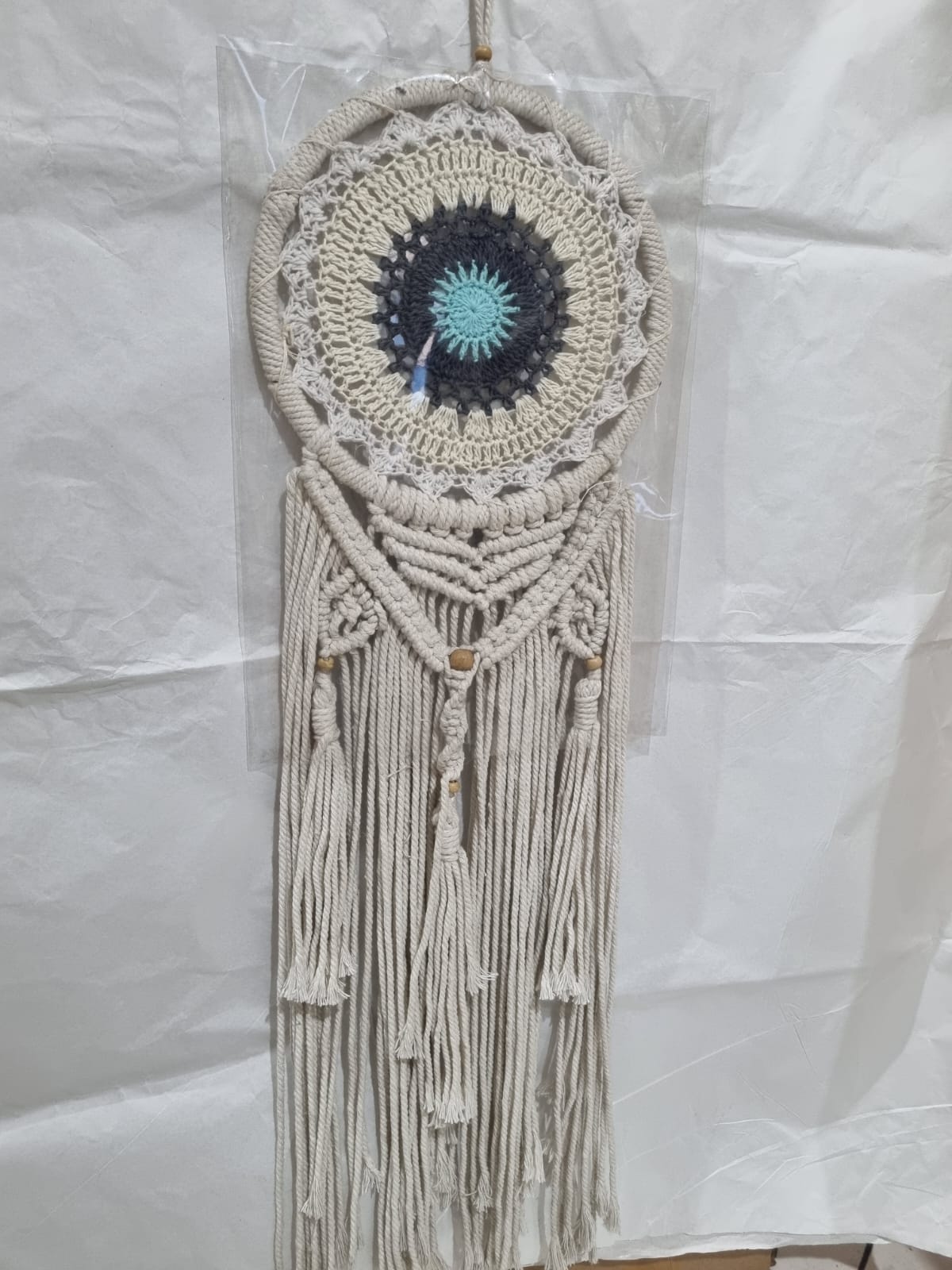 Crochet and macrame cotton dreamcatcher with evil eye motif and hanging tassels, 22cm diameter, handmade spiritual decor

